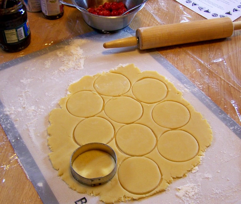 Hamentashen-cutting2; photo by L. Goldman Photo #3: Cutting cookies
