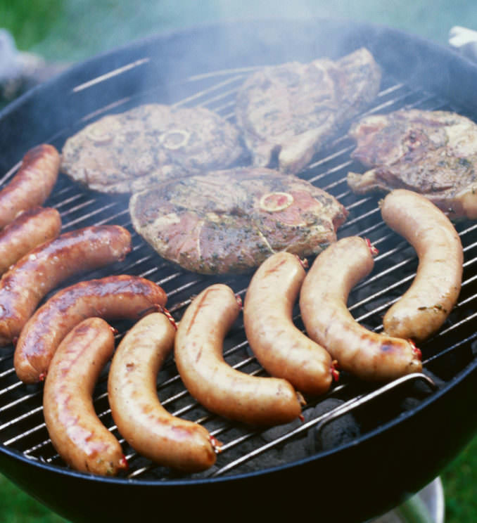 Grilled meat on barbecue grill --- Image by © Royalty-Free/Corbis