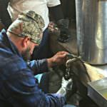Marty Forgione bottling maple syrup at Winfield Farm